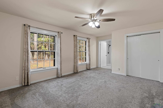 unfurnished bedroom with light colored carpet and ceiling fan