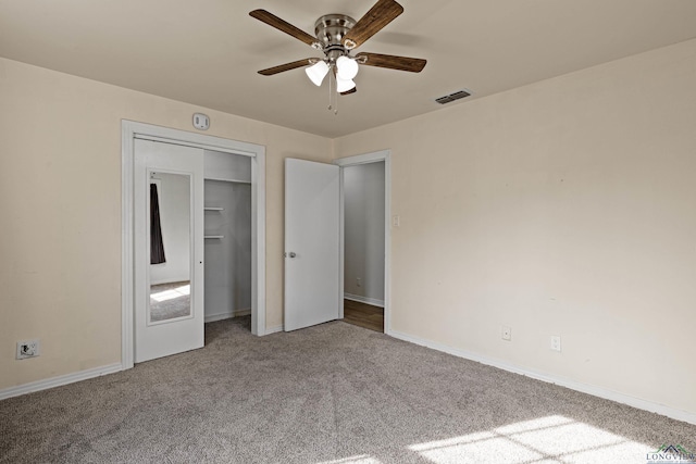 unfurnished bedroom with a closet, carpet floors, and ceiling fan