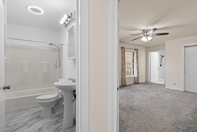 full bathroom featuring ceiling fan, shower / tub combination, sink, and toilet