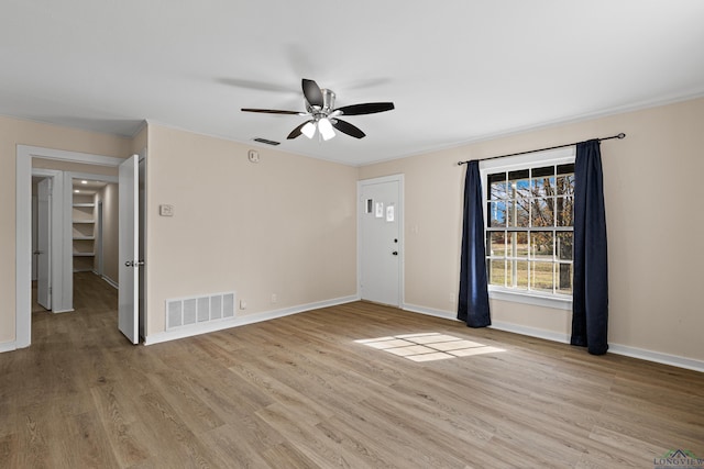 unfurnished room featuring ceiling fan and light hardwood / wood-style floors