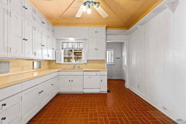 kitchen featuring wood ceiling, white dishwasher, ornamental molding, and a sink