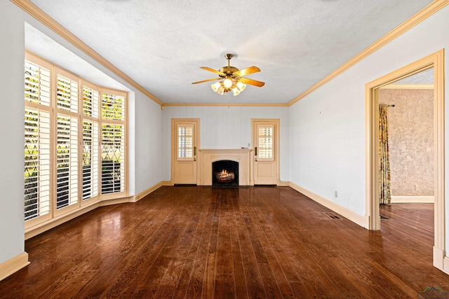 unfurnished living room with a textured ceiling, a lit fireplace, ornamental molding, and hardwood / wood-style flooring