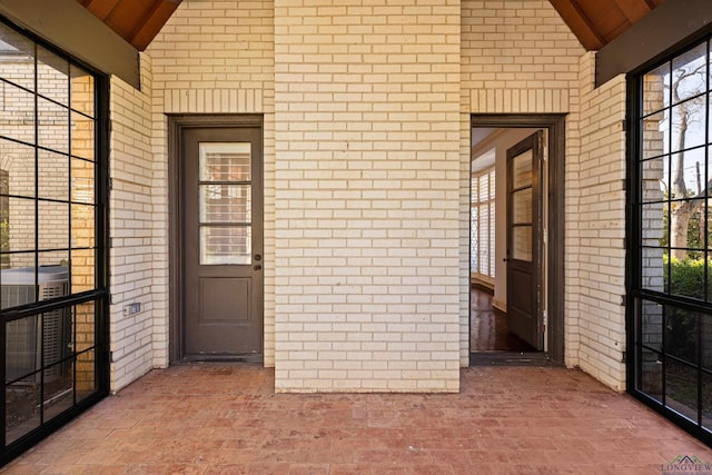 doorway to property with cooling unit