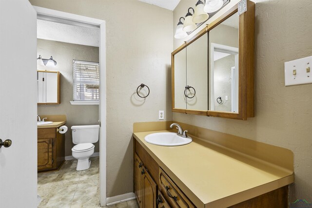 1324 Annette Dr, Longview, TX 75604 - bathroom with vanity and toilet