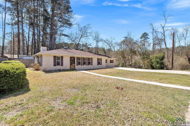 1324 Annette Dr, Longview, TX 75604 - view of front of property featuring brick siding and a chimney