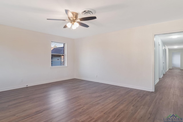 unfurnished room featuring ceiling fan and dark wood-type flooring