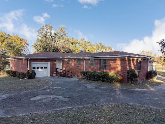 single story home featuring a garage