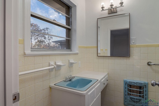 bathroom with vanity, tile walls, and heating unit