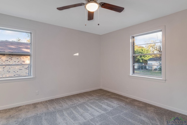 spare room with ceiling fan and carpet floors