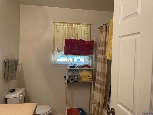 719 N Court St, Longview, TX 75601 - bathroom with vanity and toilet