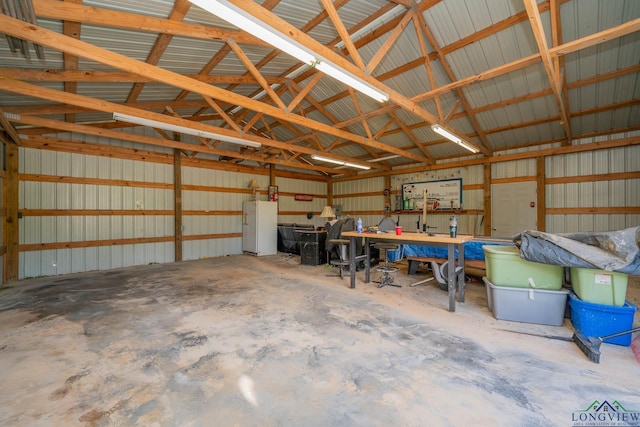 16591 Landons Way, Winona, TX 75792 - garage with metal wall and freestanding refrigerator