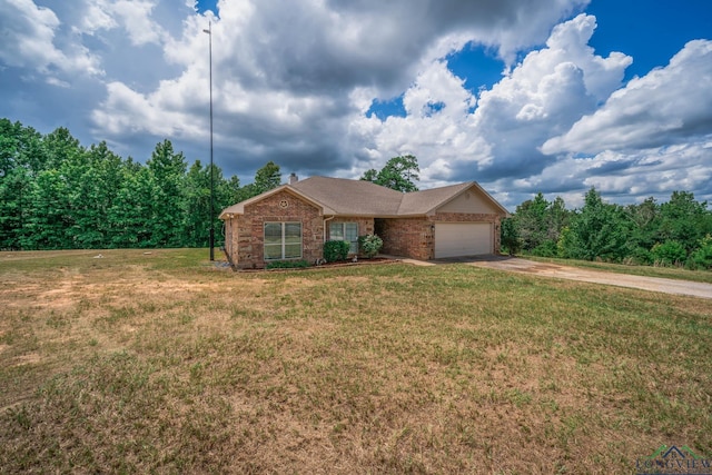 16591 Landons Way, Winona, TX 75792 - ranch-style house with an attached garage, concrete driveway, a front lawn, and brick siding