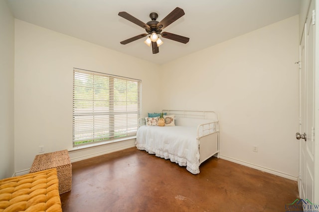 16591 Landons Way, Winona, TX 75792 - bedroom with concrete floors and a ceiling fan