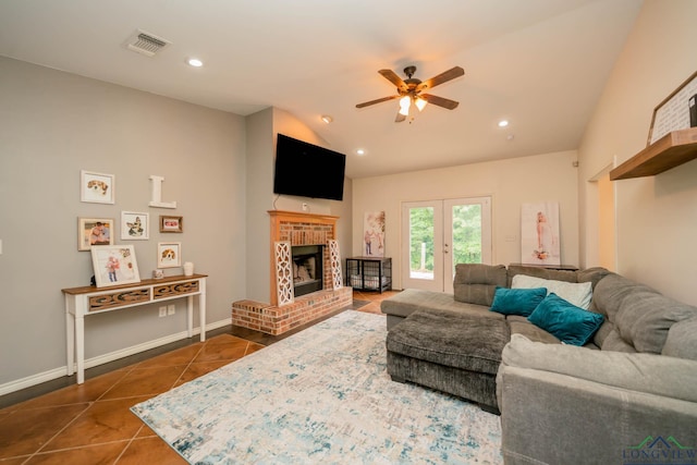16591 Landons Way, Winona, TX 75792 - living area featuring dark tile patterned flooring, ceiling fan, lofted ceiling, a brick fireplace, and recessed lighting