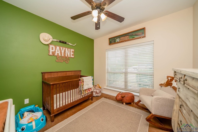 16591 Landons Way, Winona, TX 75792 - bedroom with a crib and a ceiling fan