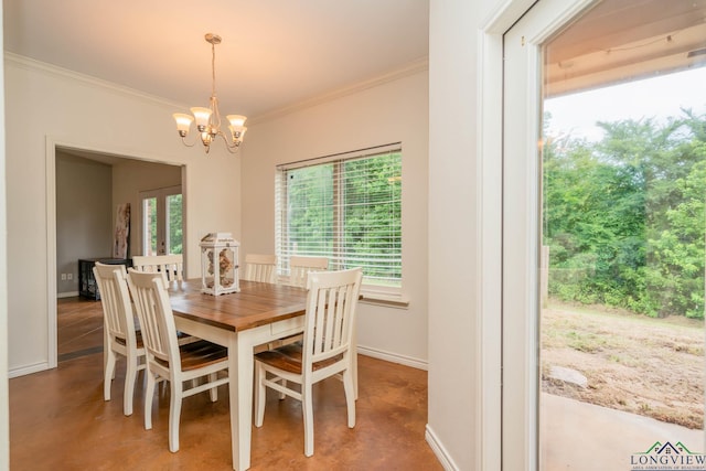 16591 Landons Way, Winona, TX 75792 - dining space featuring finished concrete floors, crown molding, and a chandelier