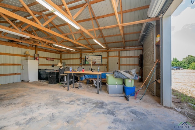 16591 Landons Way, Winona, TX 75792 - garage with white refrigerator with ice dispenser and metal wall