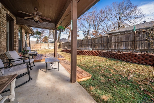 view of patio with ceiling fan and a wooden deck