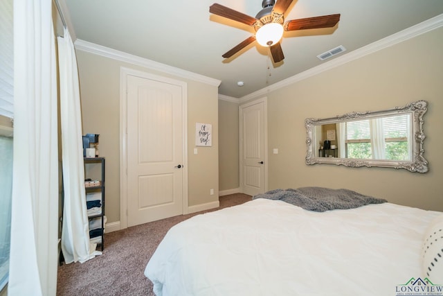 bedroom with ceiling fan, crown molding, and carpet floors