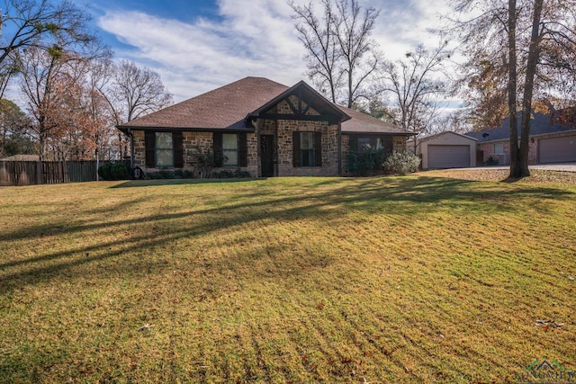 view of front of house with a front yard and a garage