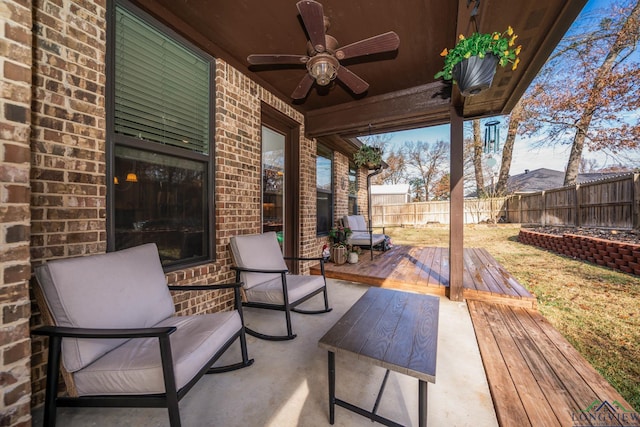 view of patio with ceiling fan and a wooden deck