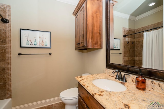 bathroom with tile patterned floors, vanity, toilet, and crown molding