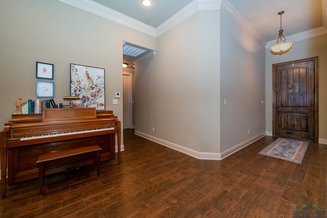 foyer with dark hardwood / wood-style floors and ornamental molding