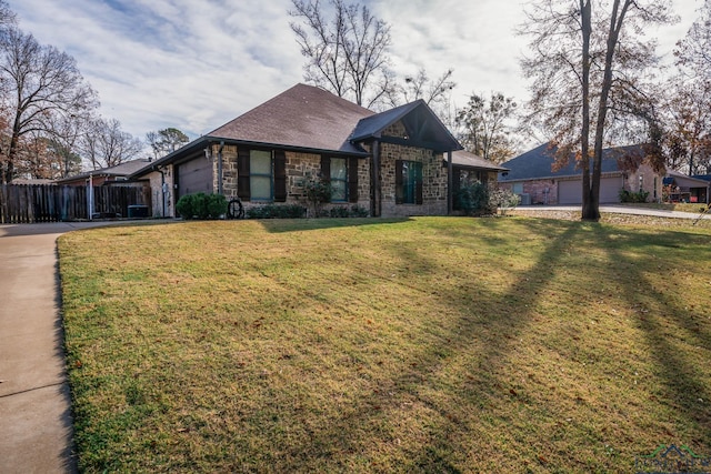 view of front of property with a garage and a front yard