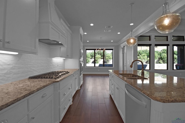 kitchen featuring white cabinets, appliances with stainless steel finishes, ornamental molding, and sink