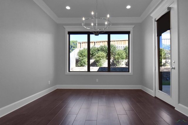 unfurnished room with ornamental molding, dark hardwood / wood-style floors, and a notable chandelier