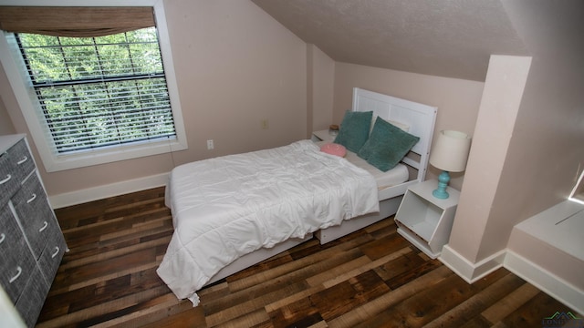 bedroom featuring dark hardwood / wood-style flooring