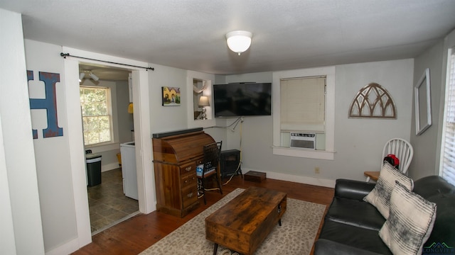 living room with dark hardwood / wood-style flooring and cooling unit