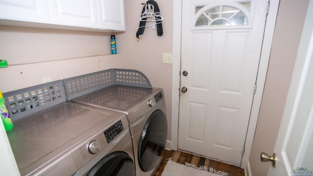 laundry room featuring cabinets, separate washer and dryer, and dark hardwood / wood-style floors