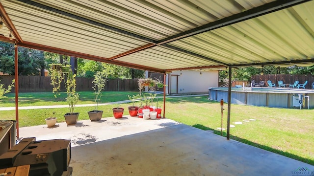 view of patio / terrace with a fenced in pool