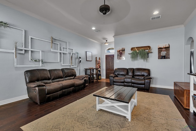 167 Labrador Ln, Hallsville, TX 75650 - living area with visible vents, crown molding, dark wood-type flooring, baseboards, and arched walkways