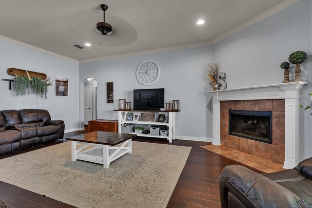 167 Labrador Ln, Hallsville, TX 75650 - living area featuring baseboards, visible vents, dark wood finished floors, arched walkways, and ornamental molding