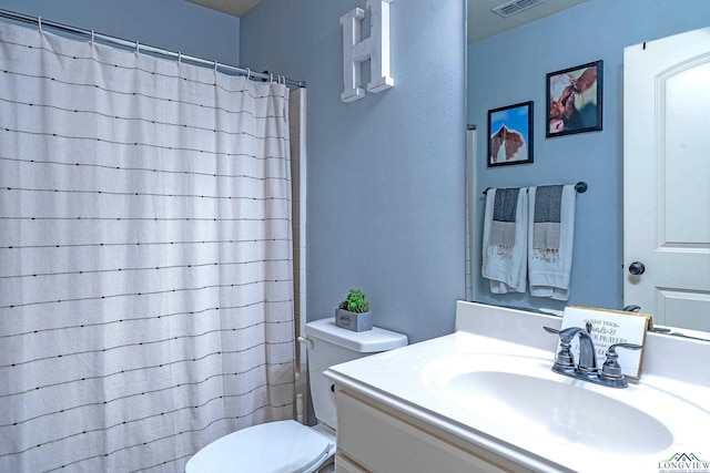 167 Labrador Ln, Hallsville, TX 75650 - bathroom featuring visible vents, toilet, vanity, and a shower with shower curtain