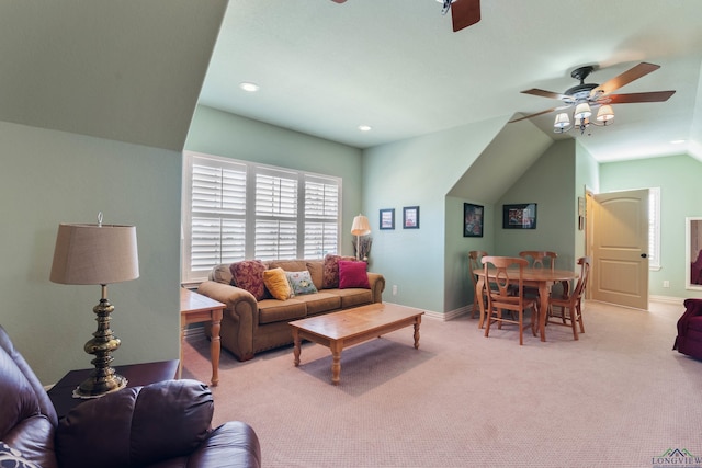 living room featuring ceiling fan and light colored carpet