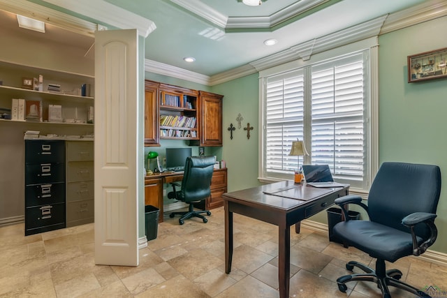 office area featuring a raised ceiling and ornamental molding