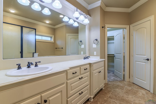 bathroom with crown molding and vanity