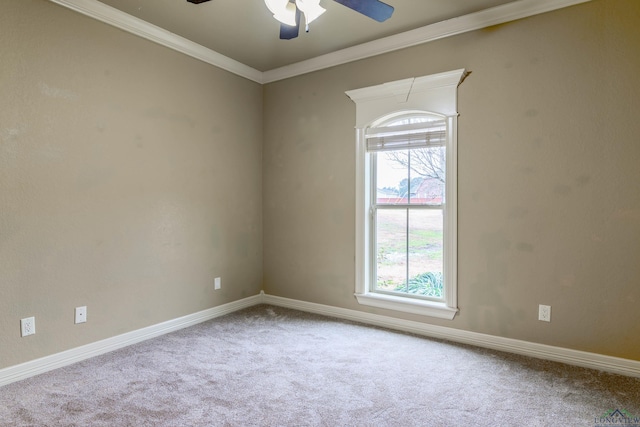 carpeted empty room with crown molding and ceiling fan