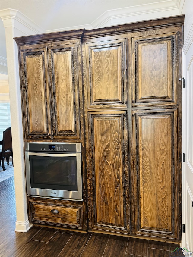 details with crown molding and oven