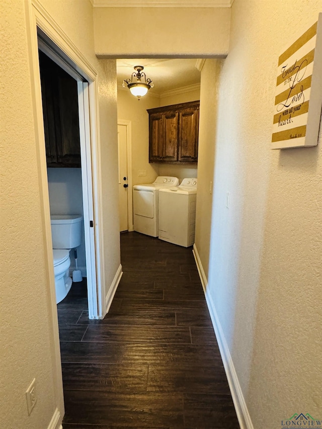 hallway featuring dark hardwood / wood-style flooring, independent washer and dryer, and ornamental molding