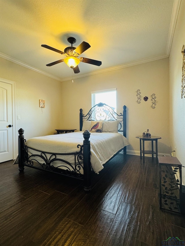 bedroom with ceiling fan, dark hardwood / wood-style flooring, crown molding, and a textured ceiling