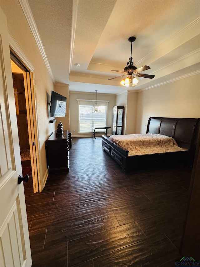 bedroom featuring a textured ceiling, dark hardwood / wood-style flooring, a raised ceiling, ceiling fan, and crown molding