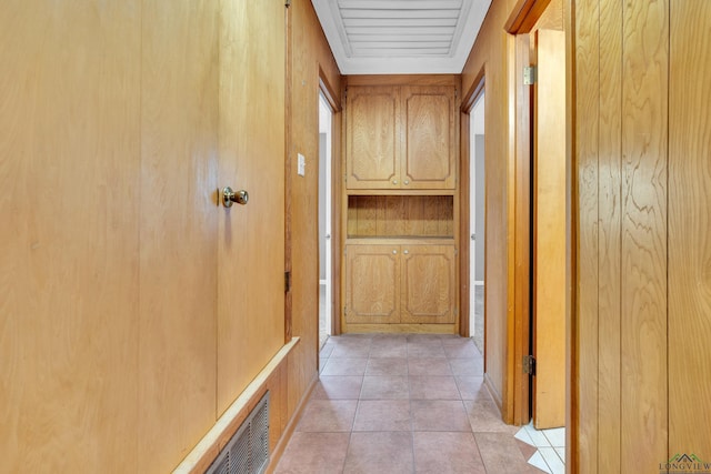 hallway featuring light tile patterned floors