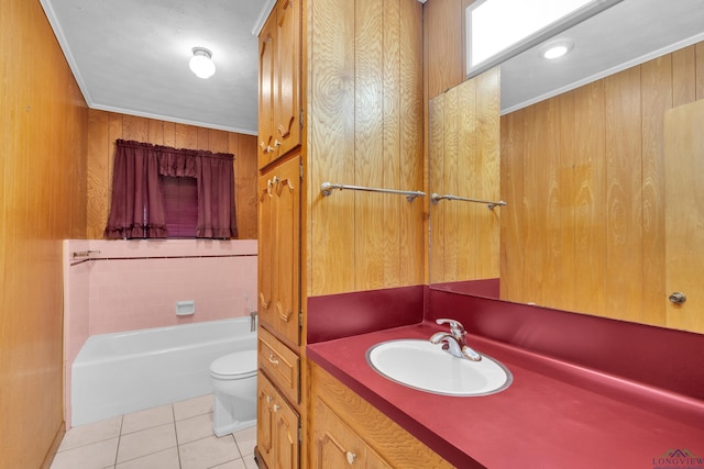 bathroom with crown molding, wood walls, toilet, tile patterned floors, and vanity