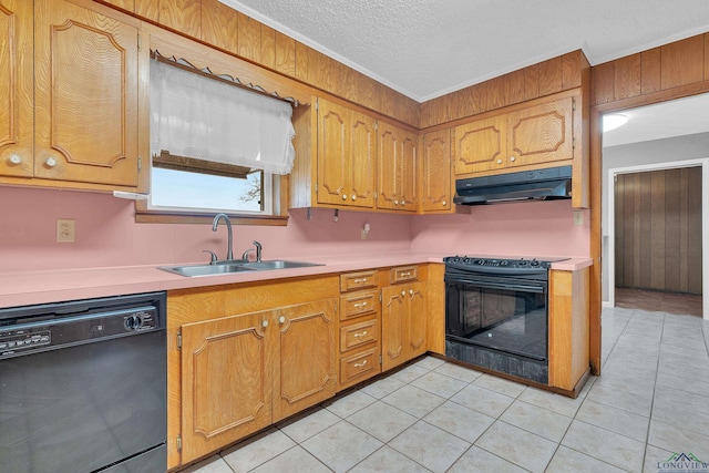 kitchen featuring a sink, black appliances, light countertops, under cabinet range hood, and crown molding