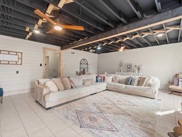 tiled living room with ceiling fan