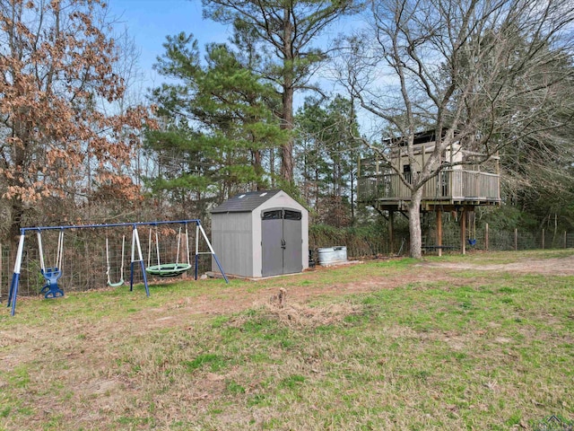 view of yard with a shed, a playground, a deck, and a trampoline